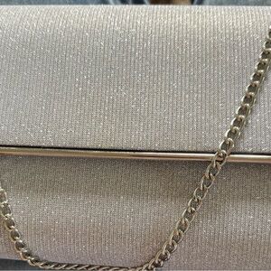 Crossbody silver glitter bag with removable chain for a clutch